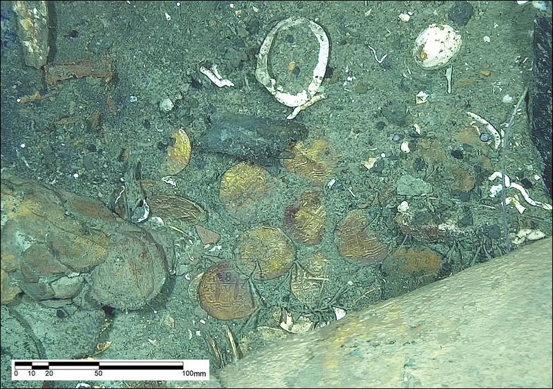 Gold coins on the seabed among the shipwreck date to the early 18th century.