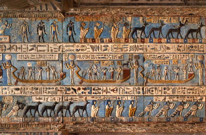 Hieroglyphic carvings and paintings on the interior walls of an ancient egyptian temple in Dendera