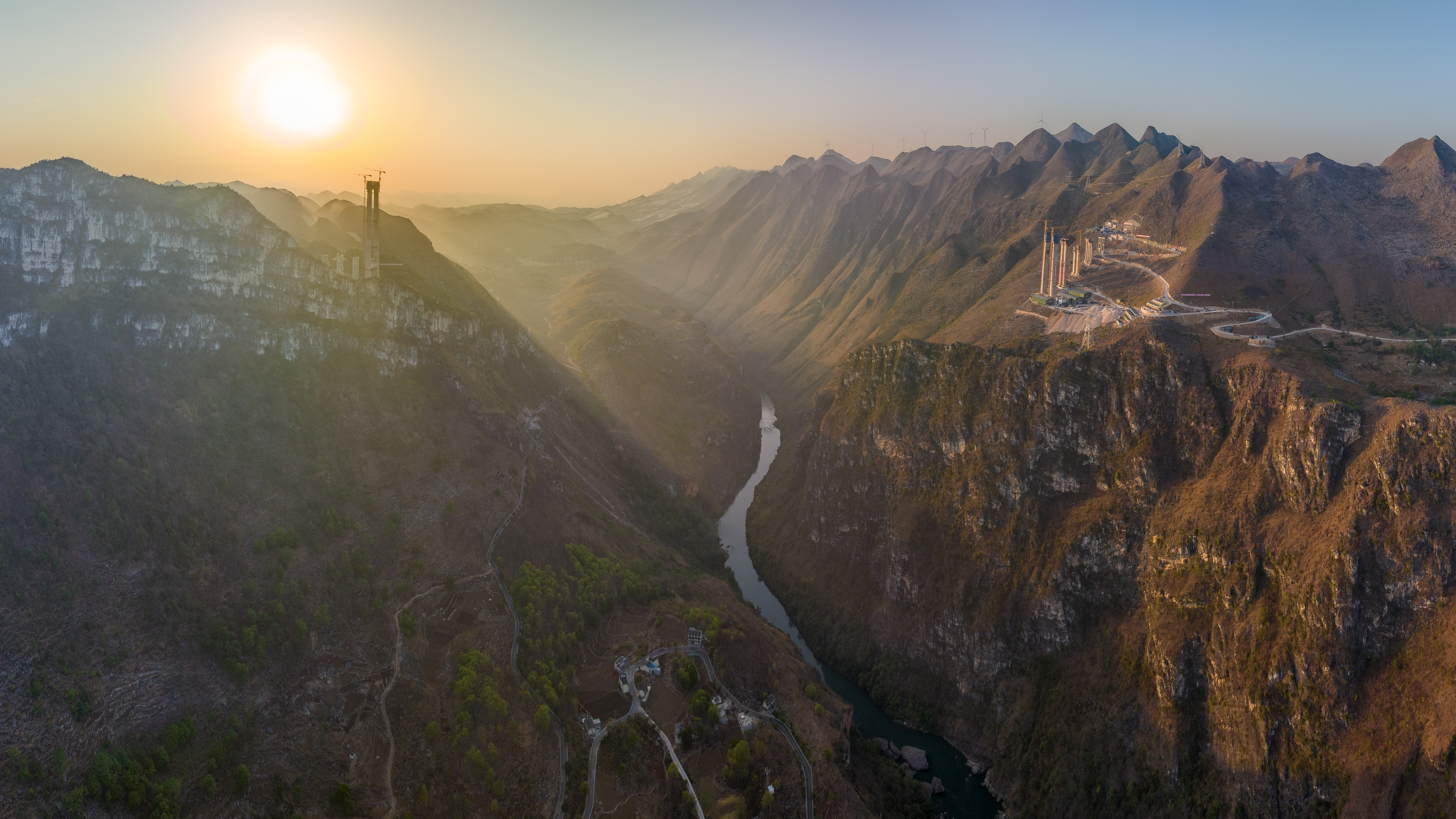 Aerial view of the Huajiang Grand Canyon at the border of Zhenfeng County and Guanling County in Guizhou, where the highest bridge is being built