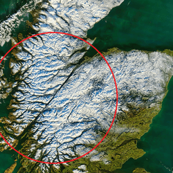 The Great Glen Fault, highlighted with a red circle, shown on a satellite image of snow-capped Scotland.
